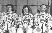 TM-12 crew seated